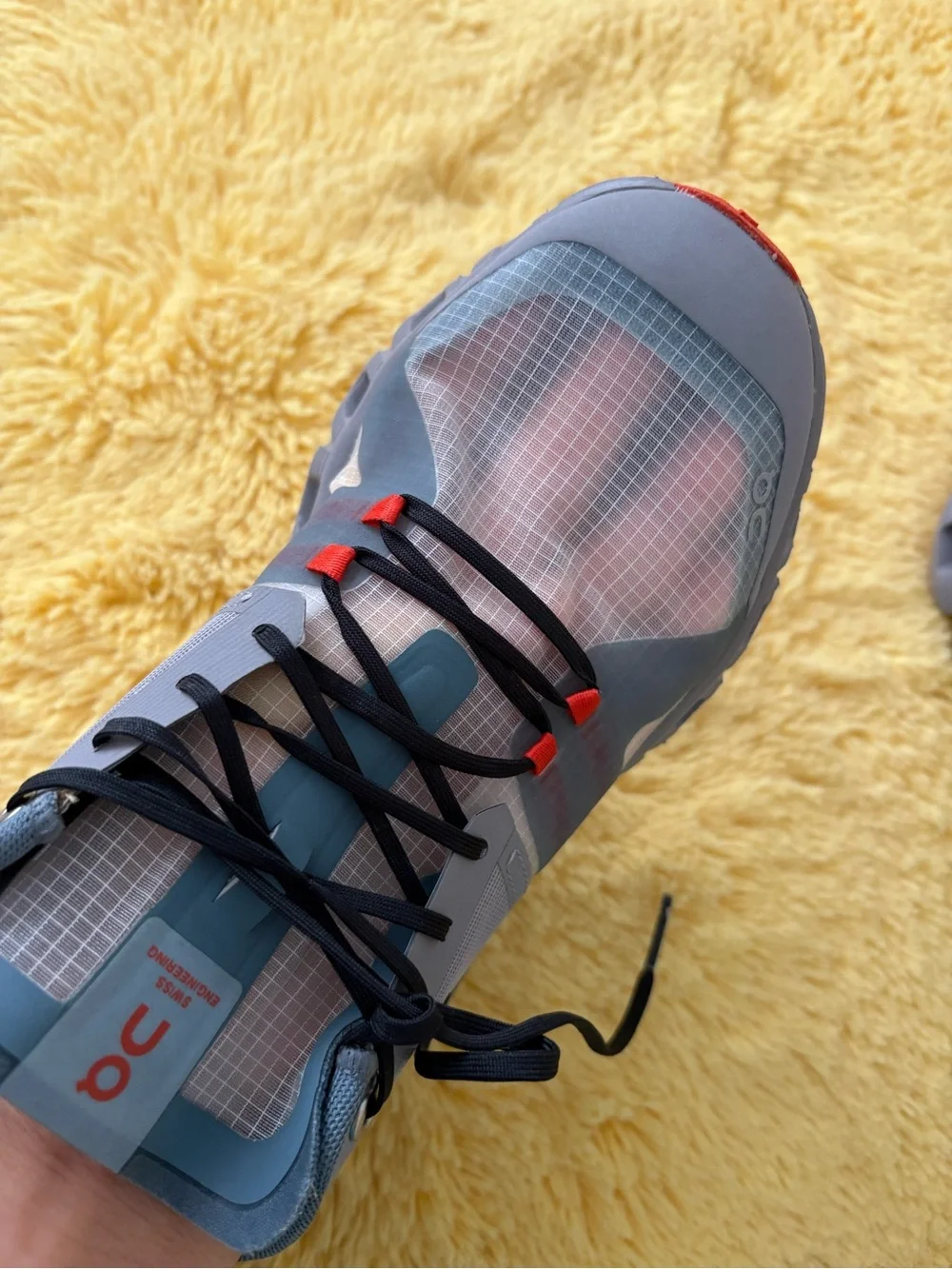 On Running Gray and Red Trail Runners